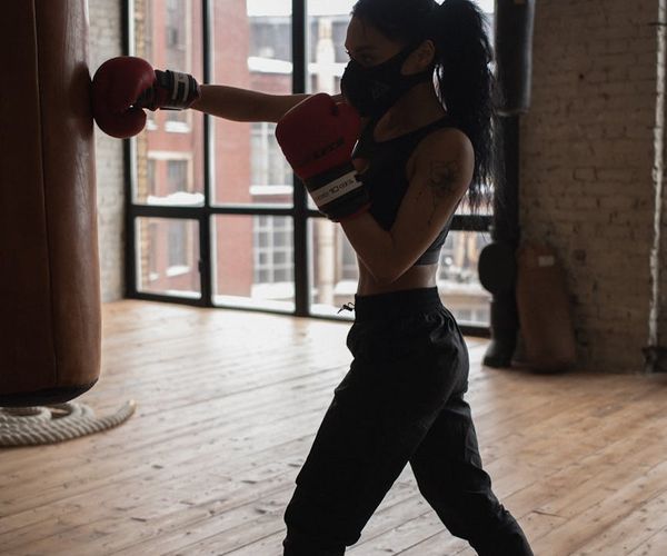 Professional athlete training outdoors during a golden sunrise.